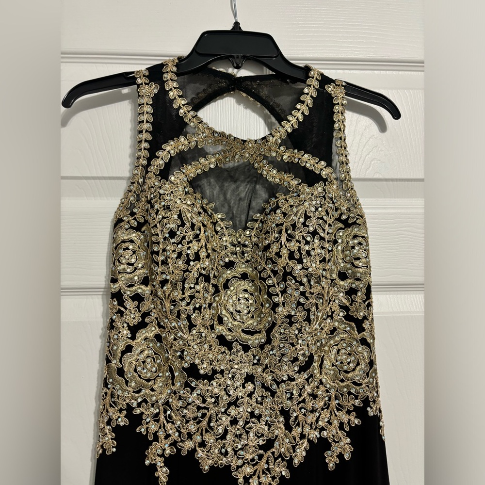 Gorgeous Evening Gown with gold Sequin bodice and black skirt one piece.